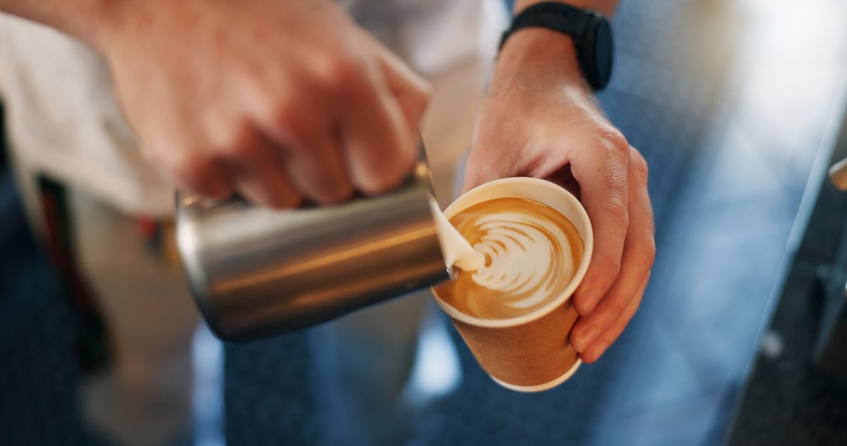 barista pouring latte art
